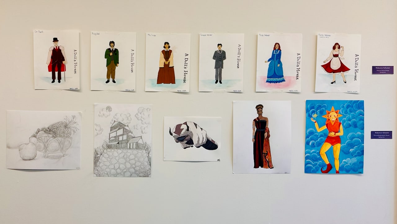 Student design work installed across a classroom wall