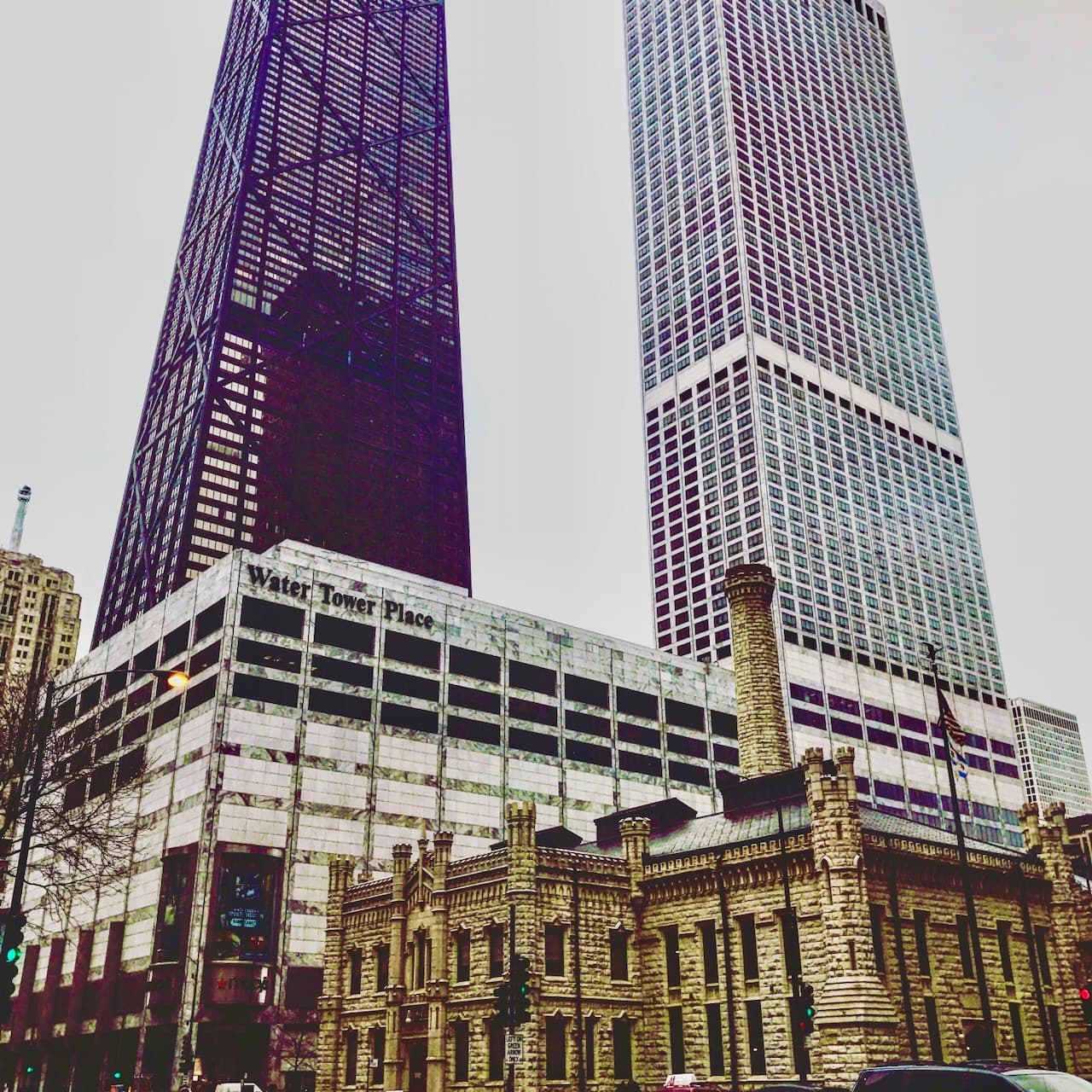 Chicago buildings around Water Tower Place with historic stone architecture and tall modern towers.