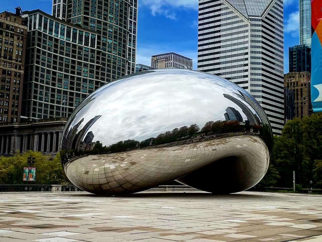 Cloud Gate in Chicago reflecting the surrounding plaza and skyline.
