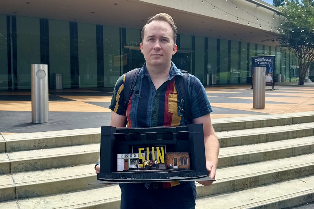 Brandon PT Davis holding a scenic model