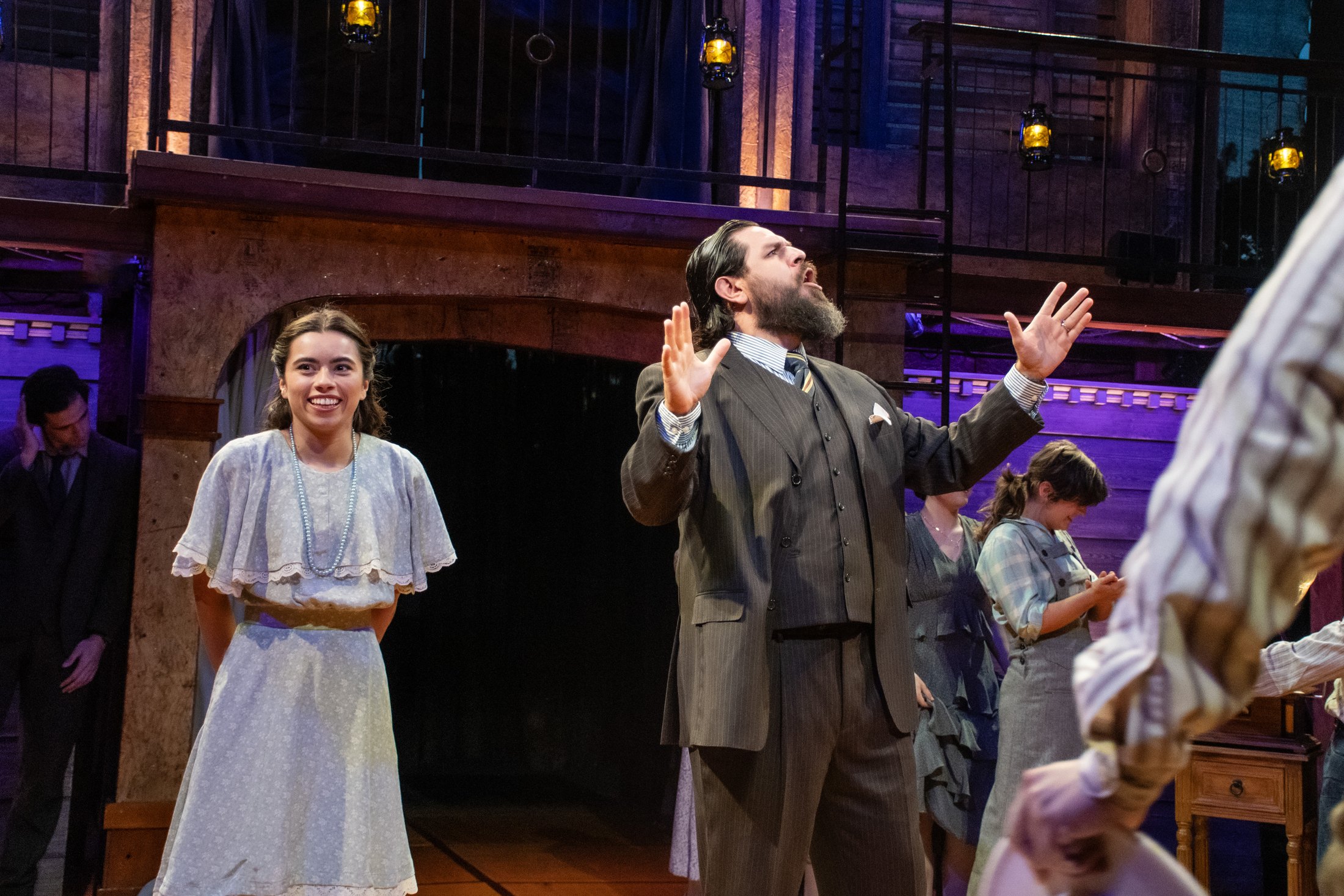 Juliet and Friar Laurence perform before the weathered Great Plains-inspired architecture.