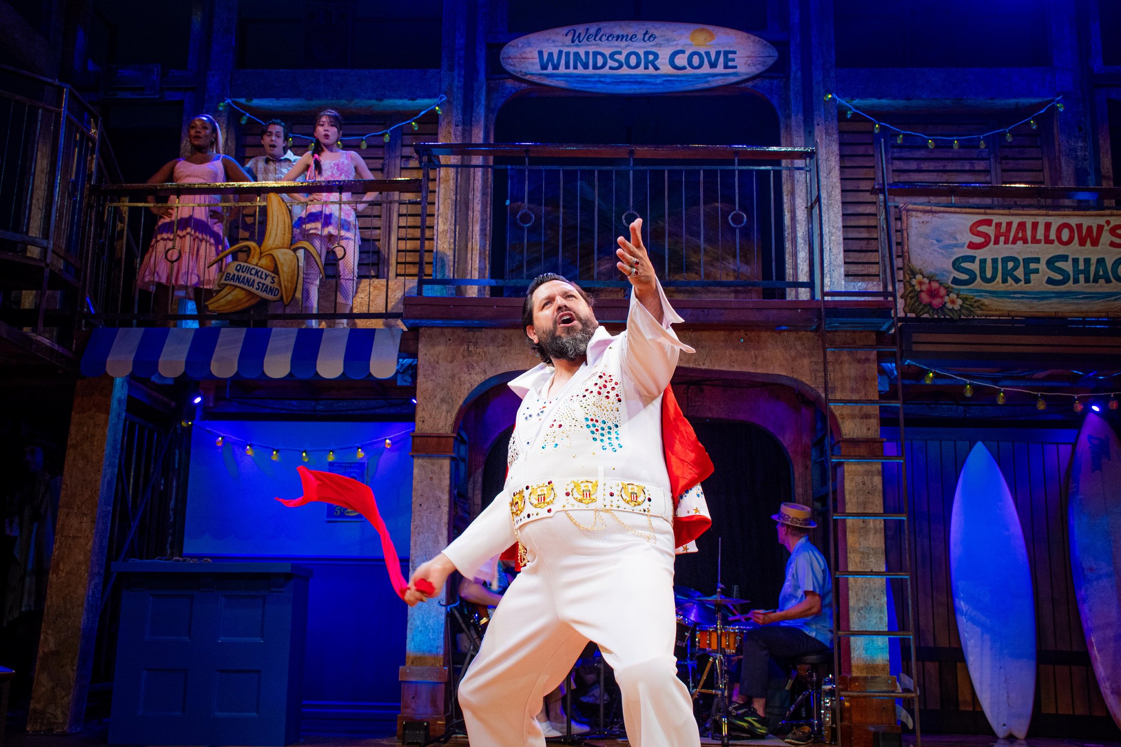 Johnny Falstaff performs beneath the upper gallery and Windsor Cove sign.