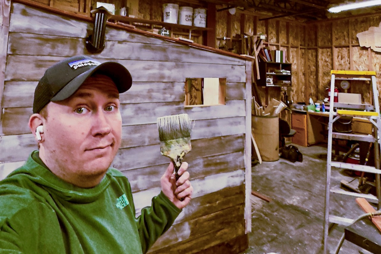 Brandon PT Davis scenic painting in a shop during winter 2025.