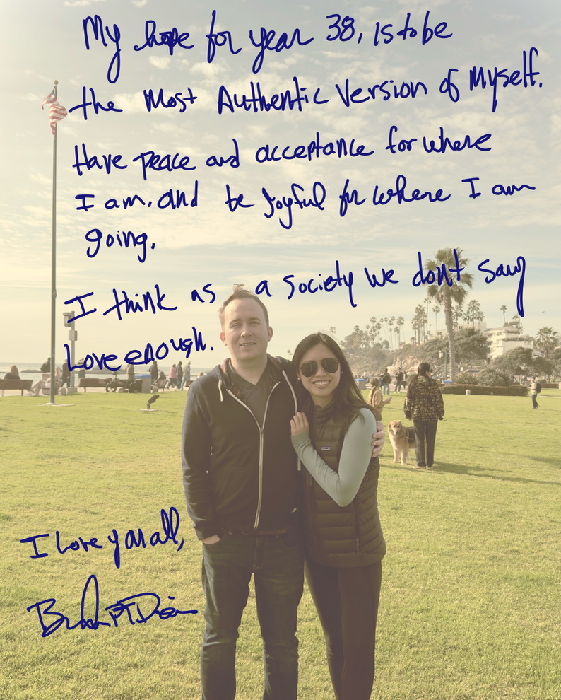 A handwritten birthday note over a photograph of Brandon PT Davis and his partner standing near the ocean.