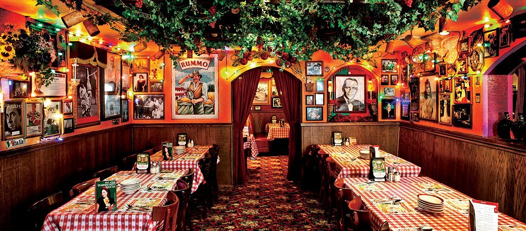 Themed dining room at Buca di Beppo with layered nostalgic and kitschy decor.