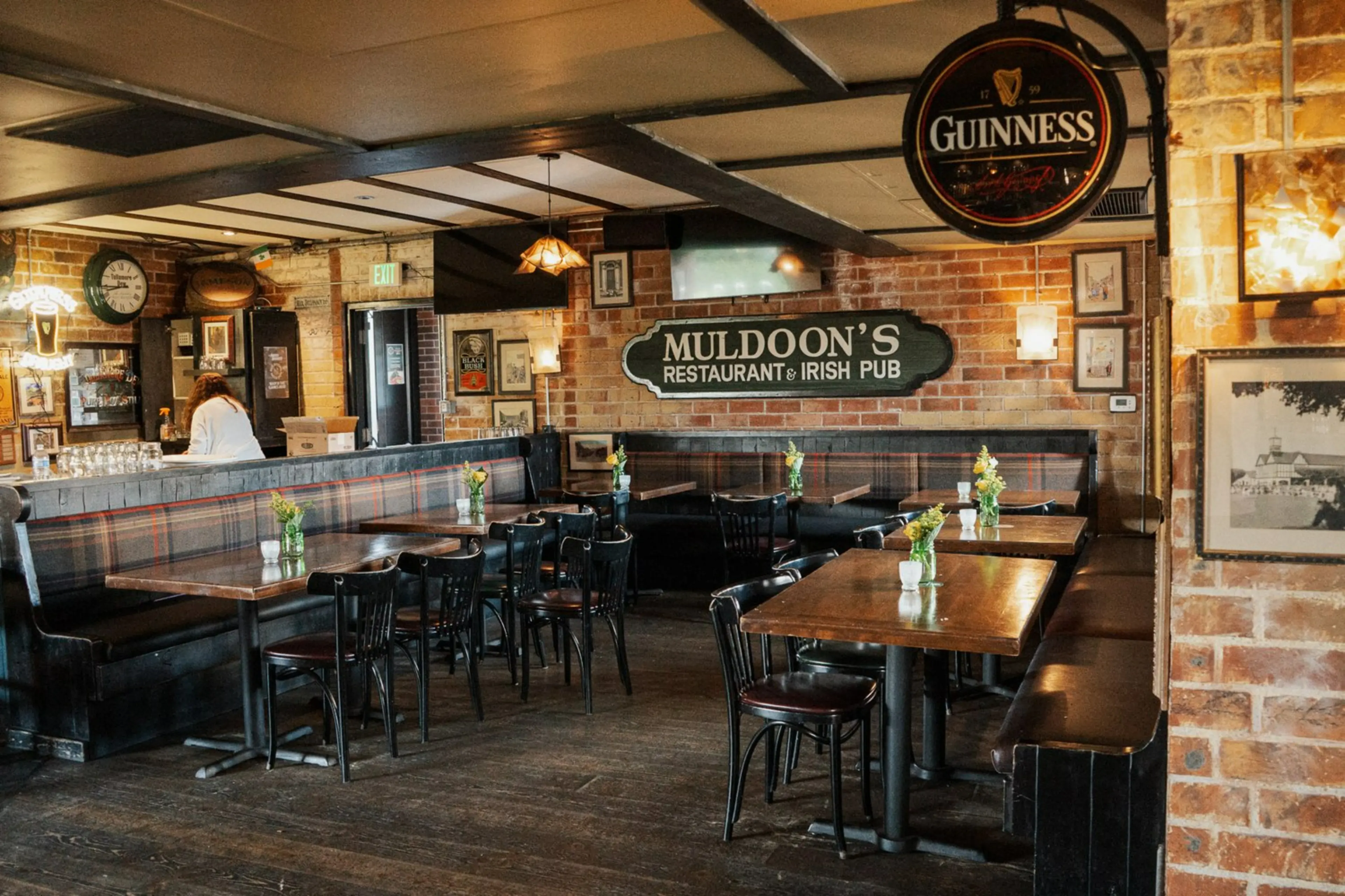 Traditional dining room at Muldoon's Irish Pub with wood details and warm lighting.