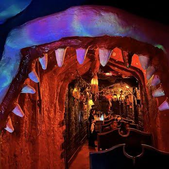 Pinocchio-inspired Belly of the Beast hidden space at STOWAWAY with whale-themed entrance.